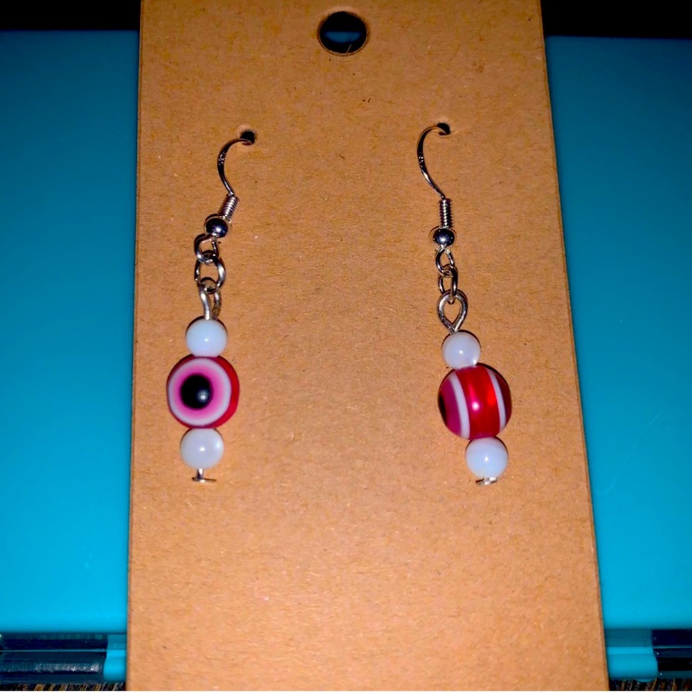 Pink evil eye dangle earrings